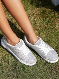 Sparkle Rhinestone Sneakers - White studded inspired women's glitter sneakers featuring shimmering fabric and rhinestones. Dazzling gemstones rhinestones, sequins and glitter create a bold look and add some sparkle and glamor to your outfit.Versatile and Comfortable - Sparkly bling sneaker with a flat sole and soft insole for stability, support and a comfortable walking experience. Even after partying at a concert all day long, your feet won't feel sore. Experience all-day comfort without sacrif Glamorous Embellished Lace-up Sneakers, Silver Embellished Low-top Sneakers, Embellished Lace-up Sneakers, Glamorous Sneakers With Bling And Round Toe, Glamorous Bling Sneakers With Round Toe, Glamorous Rhinestone Sneakers With Round Toe, Spring Bling Sneakers With Round Toe, Lace-up Synthetic Sneakers With Rhinestones, Glamorous Bling Lace-up Sneakers