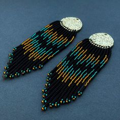 Black beaded earrings Long Fringe Clip on earrings /hooks Dangle Seed bead earrings native earrings jewelry gift Boho statement earrings Boho beaded fringe earrings for complete your look or bridesmaid gift. Also it can be a beautiful gift for girlfriend, mom or sister. Total length 4.5inches  (12 cm) Earring you get in the gift box. By your order, earrings can be made other colors and lengths. Please, write about it in the personal massage. Please note that some works are made to order and it takes time. See deadline separately for each item. If you buy several items on order - add up the time it takes to do the work. Thank you for your understanding. Please note that due to lighting effects, monitor's brightness, contrast and other parameters of the photo may be slight differences in the Black Beaded Earrings, Order Earrings, Native Earrings, Beaded Earrings Native, Long Fringe, Long Fringes, Jewelry Design Earrings, Boho Gifts, Beaded Fringe