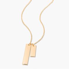 Show off your special memories and milestones with this beautiful Coordinate Date Bar Necklace. Handcrafted in golden tones, this sophisticated piece of jewelry is the perfect way to keep your treasured memories close to your heart. Surprise your loved one with this meaningful and lasting gift. Available in 14k gold plated, rhodium plated or 14k rose gold plated brass Large Bar: 1/4" by 1 1/4"; Small Bar: 1/4" by 3/4" 16" cable chain with 2" extender Lobster claw closure With engraving this item Classic Gold Charm Necklace With Square Pendant, Classic Charm Necklace For Anniversary, Classic Gold-tone Charm Necklace For Gift, Classic Gold-tone Charm Necklaces As Gift, Classic Gold-tone Charm Necklaces For Gifts, Gold Nameplate Necklace With Birthstone, Classic Gold Rectangular Charm Necklace, Elegant Rectangular Bar Necklace For Personalized Gift, Classic Gold Necklace With Rectangular Pendant