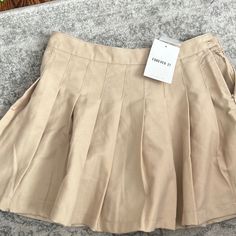 Brand New, Khaki Pleated Skirt. Size Is 9/10 But It Runs Small, I’d Say Fits Like A Size 8 Pleated Mini Skort For School, Trendy Cotton Skirt For School, Trendy Short Tennis Skirt For School, High Waist Skirt For Summer School Uniform, Casual Summer Pleated Skirt For School, Casual Pleated Skirt For School In Summer, Casual Summer School Pleated Skirt, School Uniform Mini Skirt For Summer, Cotton Pleated Skort For School Uniform