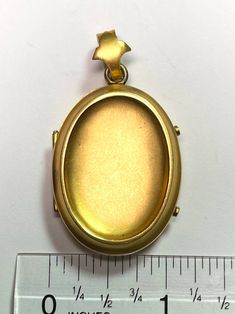 ". This beautiful oval locket has that gorgeous Victorian \"bloom\" to the gold that cannot be duplicated. It really can't be duplicated because the process has been illegal for almost 100 years now. The bale is an abstract fleur de lis shape. This locket is plated in 18k, thick enough to test 18k on the electronic tester! This locket does not have removable photo rings, but a printed picture could be carefully pressed in so it sits under the edge. I just print from my home printer on photo pape Scarab Bracelet, Photo Ring, Oval Locket, Green Mermaid, Snake Pendant, Bee Charms, Black Opal, Beautiful Bracelet, 100 Years