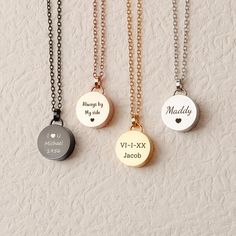 three different necklaces with names on them