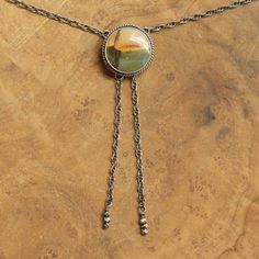 Your choice of stone will be highlighted in the photo as you choose from the drop-down below. This design is a success in so many ways. We love the traditional western bolo tie, but we wanted a more feminine version of it. We've used traditional southwestern silversmithing using .925 twist wire accents - oxidized, sanded, and polished. This necklace closes in the back with a clasp like any necklace and uses an ultra-comfortable .925 Sterling Silver rope chain - the sterling silver chain "tips" a Red Jasper Necklace, Opal Eyes, Western Bolo Tie, Bolo Necklace, Red Creek Jasper, Silver Rope Chain, Fancy Jewelry Necklace, Tie Necklace, Red Pendants