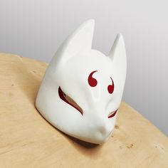 Awesome Japanese Kitsune Fox Demon Mask will complement your cosplay costume or party look! Bright colors, easy to wear, super lightweight! Features: - Super Lightweight and Extra Durable (casted of Polyurethane plastic) - ALREADY FINISHED (sanded) AND PAINTED - Attachment included Size: - length 7.5" (19 cm) - width 6.1" (15.5 cm) - height 4.4" (11.5 cm)  Fits a regular human head You will receive: - Mask (finished, painted, varnished) - Adjustable black rubberband fastening (easy to assemble) White Cosplay Costume Mask, White Mask For Cosplay, White Mask Costume Accessories For Cosplay, Fox Demon, Japanese Fox Mask, Japanese Kitsune, Cosplay Horns, Demon Mask, Japanese Fox