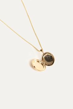 Maison Gold Oval Locket Necklace – Kinn Timeless Oval Locket Necklace For Gift, Timeless Oval Locket Necklace, Timeless Gold Oval Locket Necklace, 14k Gold Oval Link Locket Jewelry, 14k Gold Oval Pendant Locket Necklace, Classic 14k Gold Locket Necklace For Keepsake, Classic 14k Gold Locket Necklace Keepsake, Timeless Oval Engraved Locket Necklace, Classic 14k Gold Locket Necklace With Polished Finish