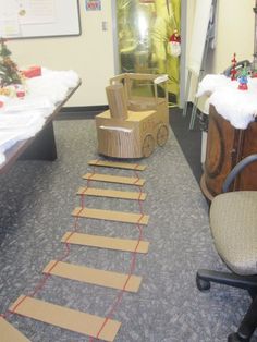 a room with several tables and chairs, one has a chair on the floor in front of it