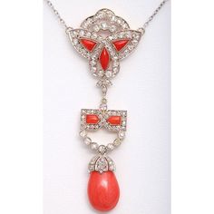 This Necklace is incredible.  The ART DECO Pendant is platinum on gold featuring coral accents and diamonds.  The pendant is 2.5" long by 1"wide.  The diamond and platinum chain was added later and is approximately 18" before the drop which adds another 2.5". Red Diamond Necklaces For Evening, Red Diamond Necklace For Evening, Elegant Orange Necklace With Polished Finish, Elegant Orange Pendant Jewelry, Elegant Red Necklace With Large Pendant, Elegant Orange Jewelry With Diamond Accents, Elegant Orange Pendant Necklaces, Diamond Drop Pendant, Coral Accents