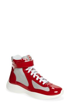 Prada creates a high-top version of its cult sneaker, which was originally designed for the Luna Rossa sailing team to wear during the 2000 America's Cup. It's crafted from a mix of patent leather and breathable mesh with a lightweight, flexible sole sporting the iconic red logo. Style Name:Prada America'S Cup Bike High Top Sneaker (Men). Style Number: 6271519. Designer High-top Sneakers With Round Toe For Sports, Designer Round Toe High-top Sneakers For Sports, Designer Custom High-top Sneakers For Sports, Sporty High-top Sneakers With Red Sole For Light Sports, High-top Sneakers With Vibram Sole, Modern Mid-top High-top Sneakers For Light Sports, High-top Sneakers With Vibram Sole For Sports, Modern High-top Sneakers For Light Sports With Vibram Sole, High-top Sneakers With Vibram Sole For Light Sports