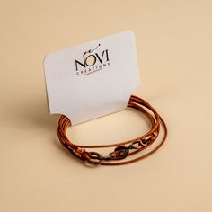 Approx. 14" Handmade in Laurel, Mississippi Beautifully colored natural brown leather with Novi's signature clasp allowing it to snap together with other NoVi bracelets for an original look. Wraps around the wrist twice, or can be worn as a choker. For a looser fit, add an extender! Adjustable Brown Bracelets As Fashion Accessory, Nickel-free Brown Bracelets As Gift, Nickel-free Brown Bracelets For Gifts, Adjustable Brown Bracelet, Everyday Brown Leather Strap Jewelry, Adjustable Brown Bracelets For Everyday Use, Casual Brown Jewelry For Everyday Use, Brown Jewelry With Adjustable Clasp, Brown Bracelet With Lobster Clasp As Gift