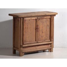 an old wooden cabinet with two doors