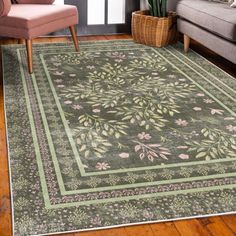 a living room area with a couch, chair and rug