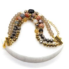 Beautiful Three Strand Bracelet Made With Natural Stones And Mixed Colors Of Glass Beads In Grays, Golds And Rhinestones. Length 7.5 Inches With A 2 Inch Extender. Handmade By Pretty Bead Dezigns! Adjustable Gray Jewelry With Colorful Beads, Adjustable Gray Bracelet With Faceted Beads, Adjustable Gray Bracelets With Faceted Beads, Gray Adjustable Bracelets With Faceted Beads, Elegant Gray Bracelets With Gemstone Beads, Adjustable Gray Beaded Jewelry, Elegant Gray Gemstone Beads Bracelets, Adjustable Gray Gemstone Beads Bracelets, Adjustable Gray Gemstone Beads Bracelet