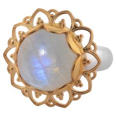 This gorgeous ring has been handmade in our workshops. We have used jaali and embossed work and embedded it with a rainbow moonstone. It has matching earrings, pendant and bracelet. It is made in sterling silver with 24ct gold vermeil. Ring dimensions - 22m x 22mm. It is available in sizes UK - M, N, O, P or USA - 6 1/4, 6 3/4, 7 1/4, 7 3/4 Gemstone Rings Vintage, Contemporary Ring, Earrings Pendant, A Rainbow, Rainbow Moonstone, Statement Ring, Matching Earrings, Gold Vermeil, Fashion Rings