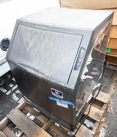 an old television sitting on top of pallets