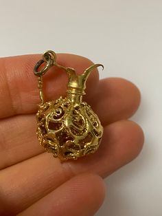 Vintage 14k yellow gold filigree jug charm. The charm is 4.54 grams of gold. Elegant Gold Charms For Formal Occasions, Elegant 14k Gold Charms For Collectors, Unique Yellow Gold Jewelry With Filigree Details, Elegant Hallmarked Charms For Collectors, Elegant 14k Gold Collectible Charms, Antique Gold Charms, Elegant Engraved Yellow Gold Charms, Unique Yellow Gold Filigree Jewelry, Elegant Vintage Charms For Collectors