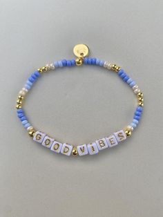 -periwinkle blue, pearl, and gold combination bracelet. -Personalize what you would like the letters to say! -One bracelet sold for each order. Order more bracelets to stack! Check out the other designs we include! -Gold beads are made with 14k gold plated beads. -Each bracelet comes with a sunset stamped charm If you have a color combination you would like that you don't see, message me and we can see if I can fulfill the request based on materials! Letter Beads Bracelet, Blue Beaded Bracelets With Letter Beads As Gift, Blue Letter Beads Bracelets For Beach, Casual Blue Bracelets With Letter Beads, Blue Gold Beaded Bracelet, Gold And Blue Jewelry, Blue Bracelet With Letter Beads, Letter Bracelet Beads Ideas, Bracelets With Letters