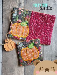 two pieces of fabric with pumpkins on them and the words honey bear studio next to it