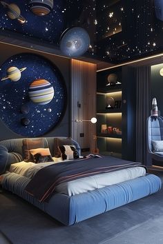 the bedroom is decorated with planets and stars on the ceiling, as well as a large bed