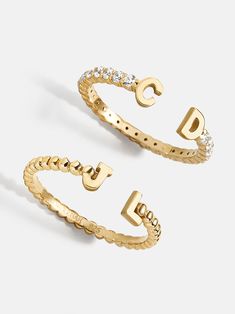 Our 18K Gold Double Initial Custom Ring is an updated take on a classic initial accessory. Available in an all-gold and a subtle sparkly version, these rings are ones you'll have for years to come. Add your own initials or that of you and a loved one to create a keepsake you'll cherish. Not to mention, this ring is crafted with 18K gold plated sterling silver and Cubic Zirconia stones. Cheap Casual Rings For Women, Cheap Customizable Rings For Women, Cute Set Of Rings, Rings And Jewlery, Tectangle Ring, Trendy Accessories Rings, Cheap Customizable Women's Rings, Dinosuar Rings, Cheap Chic Women's Rings