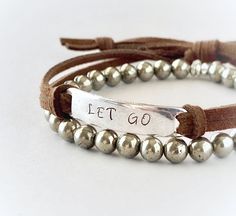 "Wear your favorite inspirational words on your wrist to remind yourself of what matters most to you every day. This unisex bracelet features the words \"Let Go\", hand stamped into antiqued pewter finished metal. You can choose any other word or short phrase you would like under \"personalization\", 8-10 letters works best with this design, but i can fit up to 13 (this includes all spaces between words also) The soft brown faux suede leather cord is adjustable and fits most wrist sizes. This li Mantra Bracelet, Stamped Leather, Comfort Gifts, Medical Bracelet, Yoga Bracelet, Yoga Gifts, What Matters Most, Unisex Bracelets, Antique Pewter