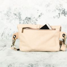 This Beige Leather Fanny Pack is the ideal bag if you like carrying all your necessities, keep your hands free and look effortlessly fashionable at the same time! Perfect for festivals, markets and travelling. Simple and beautiful bag made of a high quality Italian leather, which is soft to touch, strong, durable and a very fine material. Top grade thicker leather is used for the adjustable belt. This hip bag features one separate compartment closed by a zipper in the back and another zippered p Beige Crossbody Belt Bag For On-the-go, Multifunctional Crossbody Bags For On-the-go, Trendy Mobile Phone Bag Pouch For Everyday Use, Trendy Travel Bag With Cell Phone Pocket, Casual Satchel With Removable Pouch As Gift, Chic Chest Bag With Removable Pouch For On-the-go, Multifunctional Crossbody Shoulder Bag With Cell Phone Pocket, Trendy Mobile Phone Pouch For Everyday Use, Rectangular Beige Belt Bag For On-the-go