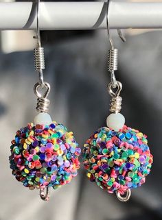 Colorful earrings for a birthday party. Cute glitter confetti dangle earrings are girly pastel earrings that will make a fun birthday gift to wear on your special day!  Adorable 1" earrings * Just the right size for women or girls  * Fun glittery confetti earrings * Silver fish hook ear wires * Rubber back stoppers More Dangle Earrings https://www.etsy.com/shop/MiksJewelryShop?ref=seller-platform-mcnav&search_query=dangle+earrings My Jewelry Collection https://www.etsy.com/shop/MiksJewelryShop?r Confetti Earrings, Birthday Earrings, Iridescent Earrings, Pastel Earrings, Birthday Accessories, Girls Fun, Glitter Birthday, Birthday Jewelry, Glitter Confetti