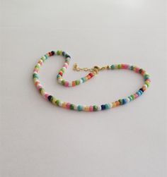 "The Dainty Colorful Beaded choker is great for summer and in the beach. It is made with small Japanese glass beads. This Beaded Choker can be perfect to wear everyday. This listing for ONE CHOKER. DETAILS - Japanese glass seed beads 4 mm - Quality strong nylon string - Choker length. Choose in the drop down menu - Lobster or round clasp closure. Available gold tone (default) or silver tone (by request) - Extension (adjustment) is 1 inch (2.5 cm). If you need longer, please, leave a note when or Summer Spacer Bead Choker Jewelry, Trendy Festival Beaded Chain Choker, Adjustable Multicolor Tiny Beads Choker, Summer Choker With Spacer And Round Beads, Adjustable Bohemian Choker With Spacer Beads, Summer Beaded Choker As A Gift, Summer Beaded Choker As Gift, Adjustable Bohemian Letter Beads Choker, Bohemian Adjustable Letter Beads Choker