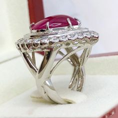 BRAND-NEW!! ONE OF A KIND, HANDCRAFTED RING. ENORMOUS & ELEGANT, 13.59 total carats weight, Certified, GORGEOUS, BURMESE RED RUBY ring. This ring offers an important statement of who you are with a GIGANTIC 10.82 carats, VIVID RED, Nearly TRANSPARENT, BURMESE RUBY. Accentuating the RUBY are the 82 E/VVS, and sparkling natural diamonds THE ITEM YOU SEE IN THE PICTURES IS THE EXACT ITEM YOU WILL GET! ONE OF A KIND, NO DUPLICATES OR TWINS SUGGESTED RETAIL VALUE: $32,500 RUBY: Weight: 10.82 cara Luxury Ruby And Diamond Oval Cabochon Ring, Luxury Ruby Ring With Oval Cabochon Diamond, Gia Certified Oval Ruby Ring In Silver, Gia Certified Oval Ruby Ring With Silver Setting, Luxury Ruby Cabochon Diamond Ring, Luxury Ruby Ring With Cabochon Cut, Gia Certified Silver Oval Ruby Ring, Luxury Cabochon Ruby Ring For Anniversary, Oval Cabochon Ruby And Diamond Ring