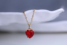 Gold filled red ruby heart stud charm pendant necklace with matching earring option Dainty minimalistic red heart tiny charm necklace High quality 18k gold plated  With adjustable chain - Length option of 14'' to 16'' ,or 16'' to 18''  chain. Dainty minimalistic pendant charm. Great as a gift ,or for yourself for that special occasion! Any questions feel free to ask! Thanks for supporting a small family run business! Comes packaged in a beautiful box ready to gift! Red Ruby Jewelry Gift For Her, Dainty Birthstone Jewelry For Valentine's Day, Ruby Clavicle Chain Jewelry Gift, Elegant Red Jewelry With Heart Charm, Ruby Clavicle Chain Jewelry As Gift, Red Heart-shaped Birthstone Jewelry, Red Fine Jewelry As A Gift For Her, Red Heart Charm Fine Jewelry, Red Fine Jewelry With Heart Charm