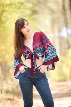 Embrace bohemian sophistication with our adaptable women's wrap top. Featuring a chic and graceful design, this handmade rayon boho top offers endless styling possibilities. Whether you prefer tying it in the front or back, wrapping it around, or innovating your own signature style, this top is destined to be a go-to in your wardrobe during summer and hot weather. This alluring top effortlessly complements various bottoms, from jeans and denim shorts to mini skirts, and exquisitely enhances the charm of romantic maxi skirts. Elevate your ensemble with this essential piece that effortlessly transitions from casual to chic for any occasion. Lannaclothesdesign products are uniquely designed and latest fashion trends. You can choose from many different colors and sizes. We use high quality pro Wrap Blouse For Festivals, Bohemian Wrap Flowy Tops, Fitted V-neck Bohemian Peasant Top, Fitted Bohemian Peasant Top For Vacation, Bohemian Wrap Top For Beach, Fitted Bohemian Peasant Top For Beach, Bohemian Fitted Wrap Blouse, Fitted Bohemian Wrap Blouse, Free-spirited Boho Print Blouse For Festival