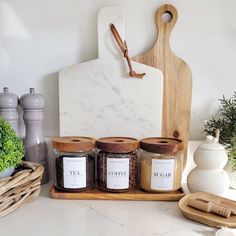 spices and herbs are arranged on a cutting board