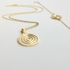 Round Spiral necklace, made of high-quality 14k gold plated chain. Dainty necklace appropriate for both everyday or special looks.  Spiral is the symbol of infinity and eternal existence.  Ideal anniversary gift! Also available in 925 Sterling Silver option.  Complete the set:  https://www.etsy.com/listing/1104147517/spiral-bracelet-bracelet-in-14k-gold?click_key=7ef248893cbaf975dd7625d86705068a8dbea0d2%3A1104147517&click_sum=afbaa32d&ref=shop_home_active_8&pro=1&frs=1 https://www.etsy.com/listi Yellow Gold Swirl Jewelry Gift, Swirl Shaped Yellow Gold Jewelry Gift, Handmade Spiral Yellow Gold Jewelry, Minimalist 14k Gold Spiral Jewelry, Gold Spiral Jewelry, Swirl Shaped Sterling Silver Jewelry In Gold Color, Minimalist Gold Spiral Jewelry, Spiral Gold-plated Jewelry, Gold Plated Spiral Jewelry