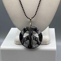 "Dichroic Art Glass Peace Sign Pendant, Black White and Silver Swirl on Black Bead Chain Necklace, Long and Dramatic Whimsigoth Statement Measurement * 36\" strand; 2\" pendant 18K White Gold Plate Bale Condition * Very nice Condition. Gently Used. Size: Unisex 36\" Condition: Pre-Owned Good" Black Wire Wrapped Necklace For Party, Black Spiritual Jewelry For Party, Spiritual Black Jewelry For Party, Adjustable Black Wire Wrapped Beaded Necklace, Adjustable Black Wire Wrapped Beaded Necklaces, Spiritual Black Necklaces For Party, Artistic Black Pendant Necklace, Unique Nickel Free Black Necklaces, Unique Nickel-free Black Necklaces