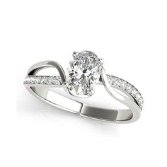 a white gold engagement ring with an oval cut diamond