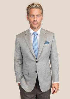 Elevate your wardrobe with our premium Glacier Grey Twill Jacket. Cut from luxurious merino wool by Vitale Barberis Canonico; this custom-made blazer exudes classic style. Neil says "The Glacier Grey Twill was inspired by the serene elegance of winter landscapes. I chose this pure merino wool for its refined twill weave and exceptional softness. It's a fabric that speaks to both formal events and sophisticated business settings, offering timeless versatility and understated charm." Elegant Outerwear With Suit Collar For Semi-formal Occasions, Formal Single-breasted Sport Coat With Lapel Collar, Luxury Business Casual Sport Coat With Flat Front, Tailored Single Breasted Sport Coat For Semi-formal Occasions, Luxury Tweed Jacket With Notch Lapel And Welt Pockets, Timeless Business Tweed Jacket With Concealed Placket, Timeless Tweed Jacket For Business With Concealed Placket, Timeless Long Sleeve Suit, Tailored Long Sleeve Timeless Suits