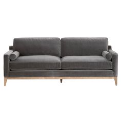 a gray couch with wooden legs on a white background