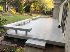 a large white deck with benches on it