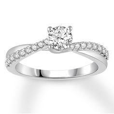 a white gold ring with diamonds on it