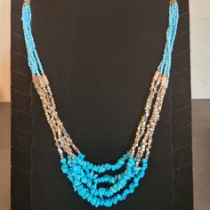 Turquoise And Silver Seed Bead Statement Necklace With Matching Earrings. Necklace Has Stainless Steel Lobster Claw Enclosure. Adjustable Blue Turquoise Necklace With Gemstone Beads, Turquoise Gemstone Beads Necklace For Jewelry Making, Elegant Turquoise Necklace With Colorful Beads, Elegant Blue Turquoise Necklace With Colorful Beads, Adjustable Multi-strand Turquoise Blue Necklace, Handmade Light Blue Multi-strand Jewelry, Light Blue Gemstone Beads For Jewelry Making, Light Blue Multi-strand Jewelry As Gift, Light Blue Multi-strand Jewelry Gift