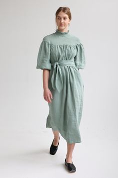 "Linen elegant dress with long wide sleeves, no shoulder line and delicate ruffle at the neck has tie detail in the back. Wide sleeves shrink with elastic at the bottom. Loose cut dress is comfy yet elegant and can be worn for various occasions. You can wear it without belt for romantic and free style or use belt to create more classic look. Belt is long enough to go around waist twice! For more chic look, style it with accessories. Double washed for extra softness and shrinkage prevention. ABOU Elegant Puff Sleeve Dress With Ruffles For Garden Party, Garden Party Dresses With Bishop And Gathered Sleeves, Spring Prairie Dress With Puff Sleeves And Ruffle Hem, Bishop Sleeve Puff Dress With Ruffles For Daywear, Daywear Puff Sleeve Dress With Ruffles, Billowy Empire Waist Spring Dress, Elegant Fitted Prairie Dress With Gathered Sleeves, Summer Dress With Pleated Bishop Sleeves, Vintage Ruffled Midi Dress For Brunch