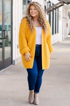 We are so in love with this fabulous cardi! It is the perfect way to add a bold touch to your wardrobe! Crafted from a soft fabric in a vibrant mustard hue, this layering piece pairs effortlessly with a range of looks - from dressed up with a dress and boots to relaxed with a solid top and skinnies! 50% Cotton, 50% Acrylic Yellow Open Front Cardigan For Spring, Spring Workwear Outerwear With Chunky Knit, Spring Workwear Outerwear In Chunky Knit, Chunky Knit Outerwear For Spring Workwear, Mustard Long Sleeve Sweater For Spring, Yellow Knit Outerwear For Spring, Spring Workwear Chunky Knit Outerwear, Chic Solid Color Cardigan For Layering, Yellow Outerwear For Fall Day Out