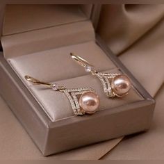 Champagne Pearl Dangling Earrings - Gold Or Rose Gold. Dimensions In Pics. Faux Champagne Pearl In Gold Or Rose Gold Setting With Rhinestones. Be15 Feminine Rose Gold Pearl Earrings For Party, Elegant Pink Metal Earrings, Elegant Rose Gold Crystal Earrings, Pink Metal Earrings For Formal Occasions, Formal Pink Metal Earrings, Sweet Earrings, Color Champagne, Stylish Earring, Trendy Earrings