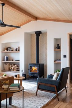 a living room filled with furniture and a fire place