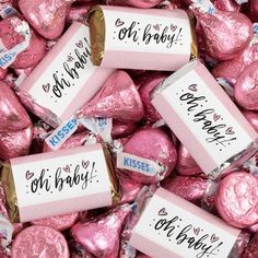 pink foil wrapped herss candy hearts with the words oh baby on them