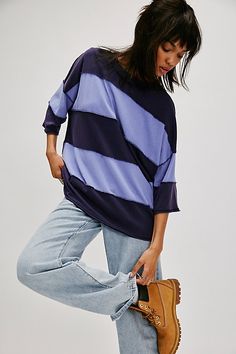 A modern take on a wardrobe staple, this easy tee from We The Free is featured in an oversized style with wide stripes and exposed seams. **Fit:** Relaxed, oversized **Features:** Comfy cotton fabrication, classic crew neckline, drop-shoulder short sleeves, wide stripes, exposed seams **Why We | We The Free Maddie Tee at Free People in Blue, Size: S Oversized Top With Striped Hem, Oversized Tops With Striped Hem For Spring, Oversized Spring Top With Striped Hem, Spring Oversized Top With Striped Hem, Blue Relaxed Fit Tops With Contrast Stripes, Relaxed Fit Blue Tops With Contrast Stripes, Oversized Striped Hem Tops For Spring, Trendy Blue Top With Contrast Stripes, Oversized Striped Top For Layering