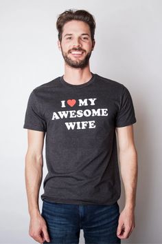 Proclaim your love and a bit of humor with our 'I Love My Awesome Wife' men's t-shirt. Whether she's got you under a love spell or you're genuinely eager to show off your amazing partner, this slim-fit, comfy tee is just the ticket. It's got all the makings of a great cuddle session with wifey, featuring a playful meme that's perfect for married life. Looking for a gift that says 'I'm proud of my choice'? This t-shirt is it! #HusbandHumor #WifeLove #ValentinesDayGift Baby Fathers Day Gift, Funny Gifts For Him, Funny Shirts For Men, Funny Valentines, Aprons For Men, Screen Printing Shirts, Love Spell, Funny Mom Shirts, Kindness Shirts