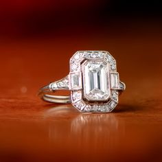 This ring is currently sold and is a ring that our jewelers can recreate with any size emerald cut diamond. If you are interested in recreating this ring, please feel free to contact us. Baguette Halo, Estate Diamond Jewelry, Platinum Diamond Rings, Emerald Cut Diamond, Baguette Cut Diamond, Platinum Ring, Emerald Cut Diamonds, Vintage Engagement, Diamond Halo