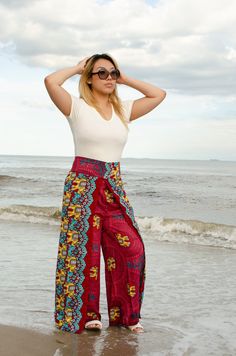 "Handmade Harem Pants | Waist Tie | Open Leg | 100% Rayon | One Size | Adjustable - Multicolor | Bohemian Style | Boho Hippie - Flower Design -Handmade in Nepal - Open leg flap design -100% Rayon -One Size -Zip pocket - Floral Design - Free flowing style - Delicate machine wash with Cold water and hang dry Sizing: Waist: 30\"-36\" inches Length: 36\" inches Model: 5'2, 125 lbs. Return Policy: If you are not satisfied with your item, you must return your item in 7 days. After 7 days, there will b Bohemian Bottoms With Vibrant Print For Spring, Bohemian Wide Leg Bottoms With Floral Print, Wide Leg Boho Print Pants For Vacation, Patterned Boho Print Bottoms For Summer, Patterned Bottoms With Boho Print For Summer, Bohemian Printed Bottoms For Vacation, Bohemian Bottoms With Vibrant Print For Vacation, Bohemian Stretch Pants For Vacation, Patterned Bottoms With Boho Print For Spring