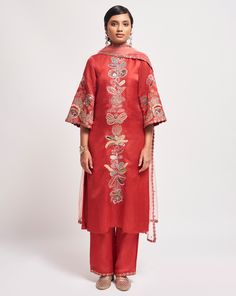 Kinfolk rust red applique embellished linen satin straight kurta, pant & tulle dupatta.From Aisha Rao's Kinfolk collection. DELIVERY TIMEPlease allow 6-8 weeks for your outfit to arrive. FABRIC DETAILSSatin, Tulle Professional cleaning only. Red Embroidered Slub Silk Kurta, Red Cotton Silk Kurta For Eid, Red Cotton Silk Sets With Dupatta, Red Cotton Silk Kurta With Chikankari Embroidery, Red Raw Silk Salwar Kameez With Sheer Dupatta, Red Embroidered Cotton Silk Sharara, Traditional Palazzo Set With Sheer Dupatta For Celebration, Festive Tussar Silk Palazzo Set For Eid, Eid Festive Tussar Silk Palazzo Set