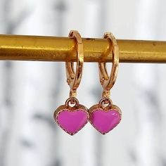 Enamel  Lilac Heart Earrings. Sweet little Heart Earrings to make you smile. 2 earrings. Treat yourself on Valentines Day  Modern classic small golden hoop huggie earrings.   Perfect valentines day gift. The earring open with a simple lever. Lightweight simple design, very easy to wear everyday, you won't even feel you're wearing any. Materials Hoops are high quality gold plate over brass with a stainless steel post.  Perfect for sensitive ears.  To keep your jewellery looking fabulous do not ge Lilac Heart, Smile 2, Earrings Gold Hoop, Golden Hoops, Heart Earring, 2 Earrings, Small Hoop Earrings, Organza Gift Bags, Display Cards